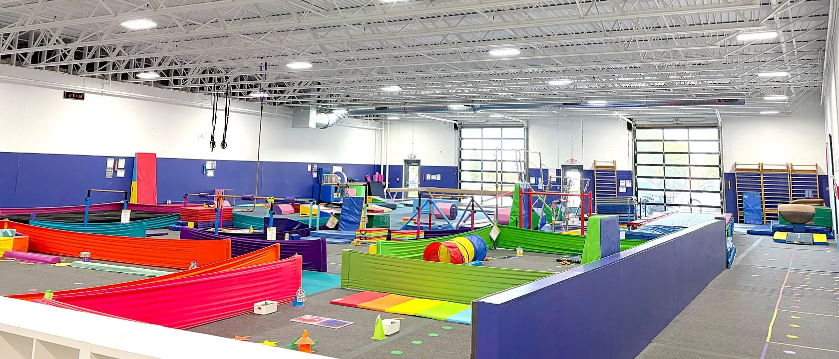 Inside the Northeast Minneapolis gym — colorful stations set up across the floor